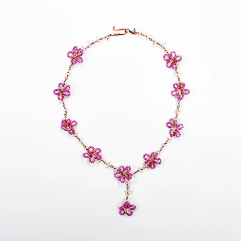 Nadia Dajani Handcrafted Beaded Necklace – Elegant Pink Floral Design with Shimmering Clear Stone Accents and Copper-Toned Wire - King Hussein Cancer Foundation