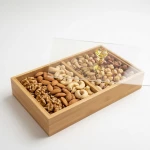 A natural bamboo serving tray with a transparent acrylic lid and a luxurious crystal handle  an elegant dish for storing and serving sweets, dates, and pastries; a modern design for hospitality, events, and everyday use with a sophisticated and attractive touch - Kitchen house