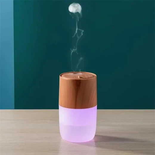 مبخرة زيت عطرية أنيقة مع شحن لاسلكي وتصميم عصري للمنزل والمكتب. متوافقة مع جميع الزيوت العطرية والعطور. لون أسود - Image 2