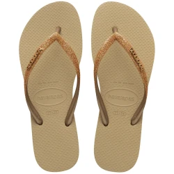 شبشب Havaianas Slim Glitter II باللون البيج والذهبي الفاتح المعدني، مقاس 37/38، بتصميم لامع أنيق وأشرطة جليتر، خفيف ومريح، مثالي للشاطئ والمسبح