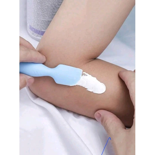 Small blue silicone spatula for applying baby ointments and diaper rash cream, with a suction cup for convenient, hygienic storage - Image 3