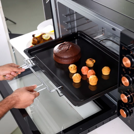 Geepas 100 L Multifunctional Oven- GO34059| 2800 W, With Rotisserie, Convection Functions and Inner Lamp| Easy to Use Control Knobs, 7 Stages Heating Selector, Adjustable Temperature| Perfect for Baking, Roasting, Cooking Meat, Vegetables, Cakes, Etc.| Bl - GEEPAS - Image 4