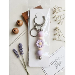 Purple beaded flower keychain with a delicate handmade design, perfect for decorating bags and keys and adding a stylish feminine touch