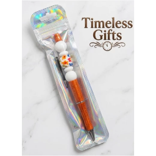 Orange beaded pen decorated with bead detailing, featuring an elegant handmade design perfect for gifting and daily use - Timeless gifts - Image 2